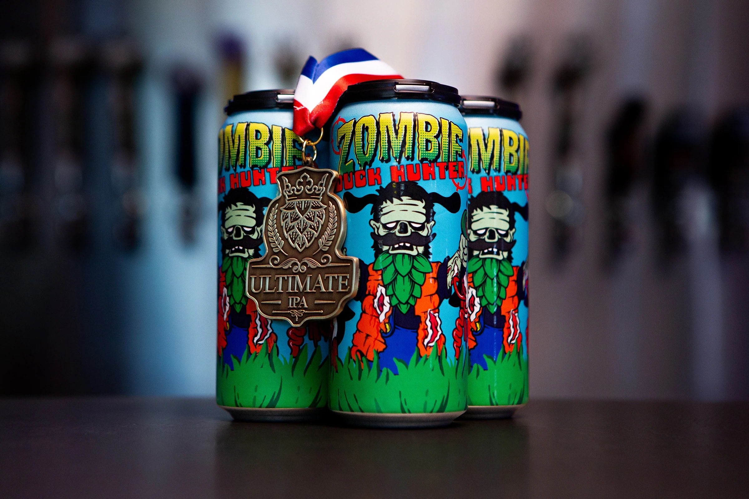 Zombie Duck Hunter 16oz cans with a Colorado Ultimate IPA bronze medal